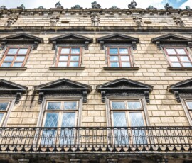 Facade of an old architectural building, classical architecture.